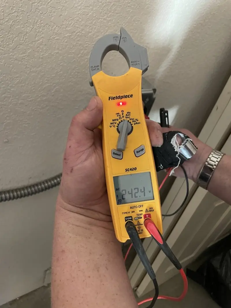 Voltage testing with clamp meter during Outlet Installation in Lebanon